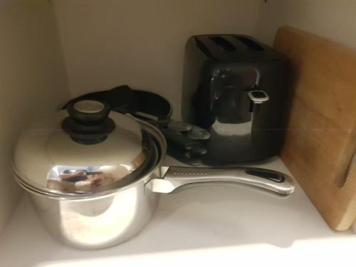 a kitchen counter with a coffee pot and a toaster at Rain Cha Am - Hua Hin by J&P in Cha Am