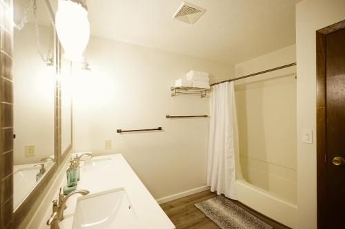 a bathroom with a sink and a shower at Blue House 2 in Sioux Falls