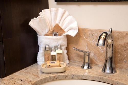 a bathroom counter with a sink with a towel at K B M Resorts Kaanapali KPL-41 3 bdm wRental Car in Kaanapali