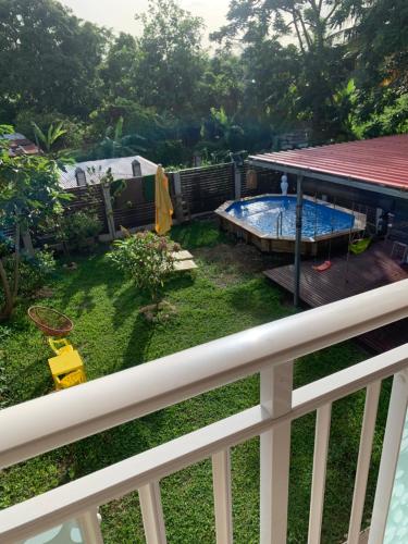 a view of a backyard with a swimming pool at Villa CIDEHO in Lamentin