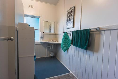 a small kitchen with a sink and a refrigerator at BIG4 Stanley Holiday Park in Stanley