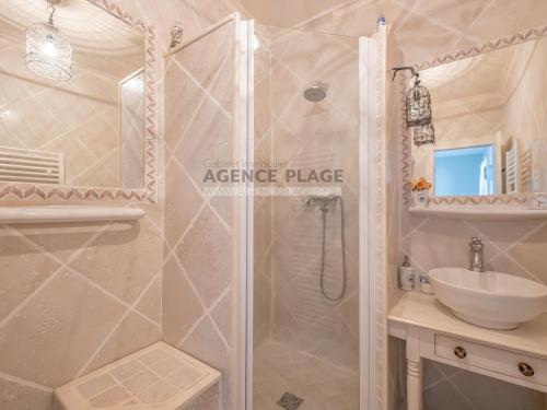 a bathroom with a shower and a sink at Maison 3 chambres, accès plage direct, proche centre et commerces - FR-1-197-550 in Les Sables-dʼOlonne