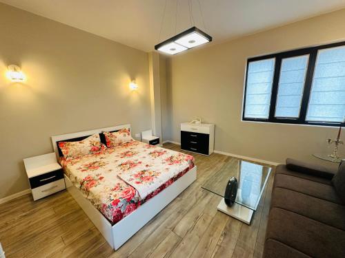 a bedroom with a bed and a window at Nataly New luxury apartment on Black sea in Varna City