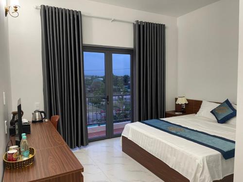 Đức Lưu Quang Hotel Bình Thuậnにあるベッド