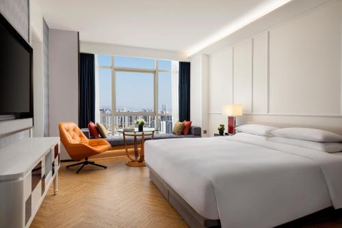 Postel nebo postele na pokoji v ubytování Yiwu Kaison K Hotel