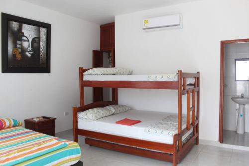 Postel nebo postele na pokoji v ubytování CASAS BLANCAS Coveñas