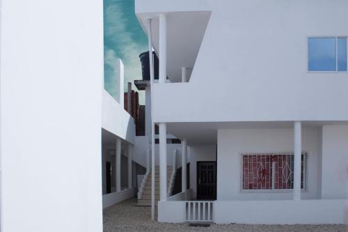 a view of a white building with white stairs at CASAS BLANCAS Coveñas in Coveñas