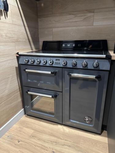 a stainless steel stove in a kitchen at Laurieston Penthouse in Grahamston