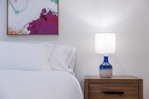 a blue and white lamp on a night stand next to a bed at Secluded Forest Oasis - Your Ultimate Retreat Awaits! in Montara