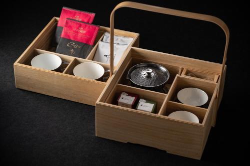 a wooden box filled with differentiatesiatesiatesiatesiatesiatesktop at THE HOTEL HIGASHIYAMA KYOTO TOKYU, A Pan Pacific Hotel in Kyoto