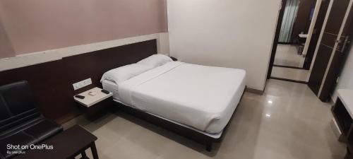 Una cama o camas en una habitación de Hotel Dreamland