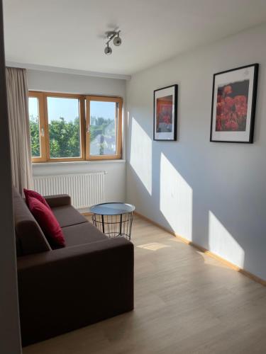 a living room with a couch and a table at Gut Schlafen - Am Kogl in Hypolz