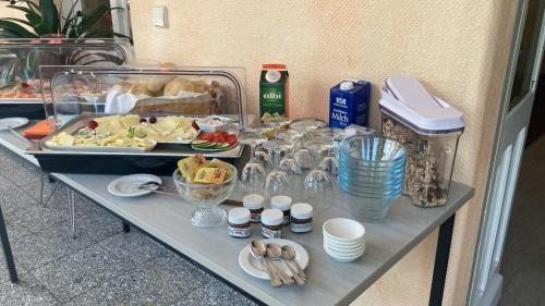 a table with a buffet of food on it at Haus Brandenburg in Stechlin