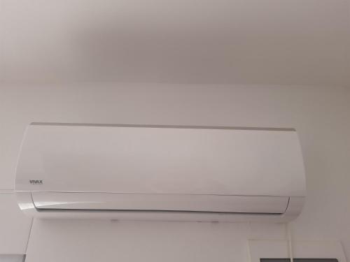 a microwave oven in a room with a white ceiling at Nino Lux Apartments Ulcinj in Ulcinj