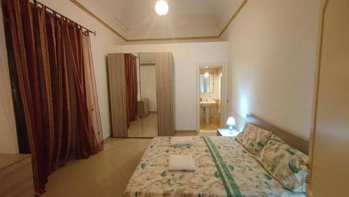 Un ou plusieurs lits dans un hébergement de l'établissement Appartamento Corso Savoia
