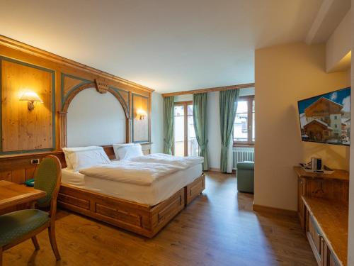 Кровать или кровати в номере Hotel Cervo