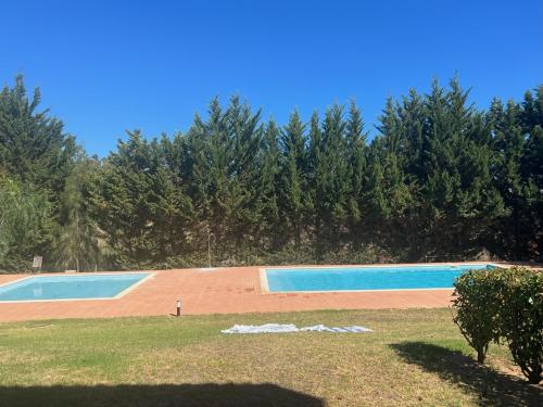 Der Swimmingpool an oder in der Nähe von Villa Alvor piscina praia e golf