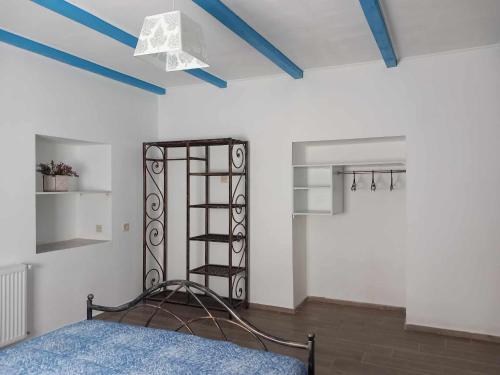 a bedroom with a bed with a wrought iron headboard at Guest house of gnomes in Akhmety