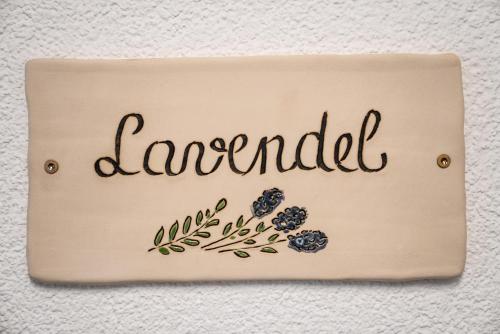a sign with the word lancelot on a wall at Appartements Tyrol in Pettneu am Arlberg