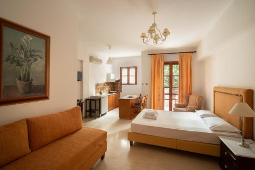 a living room with a bed and a couch at Alta Vista Studios - ex Lekka's House in Monemvasia