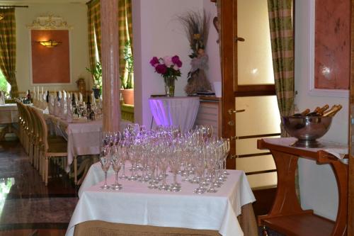 a row of wine glasses on a table in a restaurant at Il Gladiatore in Augsburg