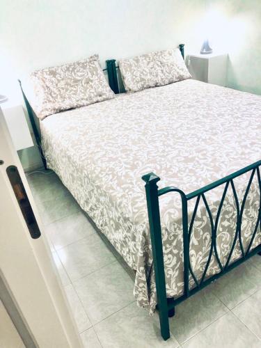 Postel nebo postele na pokoji v ubytování Residenza Tigli Campomarino Lido