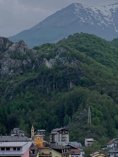 a mountain with a town in front of a city at Casa Turchina in Vernante