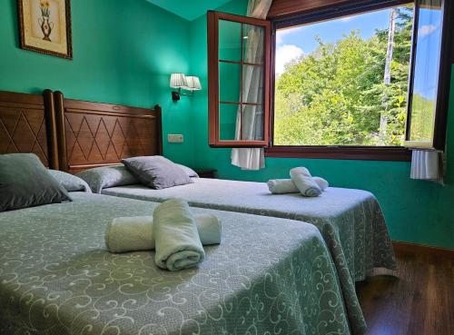 Säng eller sängar i ett rum på Hotel Rural Casa Migio