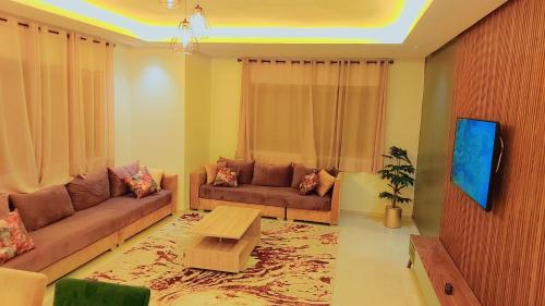 Μια τηλεόραση ή/και κέντρο ψυχαγωγίας στο Appartement Costa Bouznika