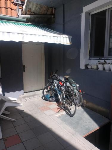a pair of motorcycles parked outside of a building at Aleksinac Centar Two-Bedroom Apartment in Aleksinac