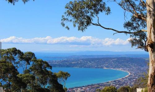 a view of a bay from the top of a hill at Top of the Bay in Arthurs Seat