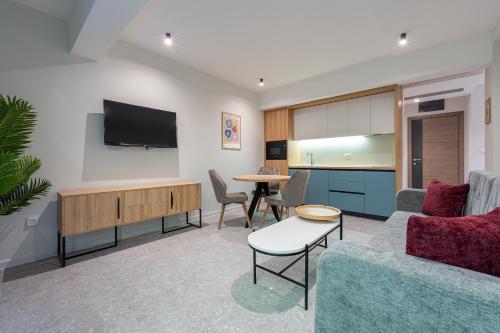 a living room with a couch and a table at Bonita Residence in Dobrota