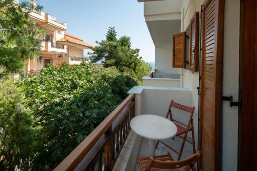 a balcony with two chairs and a table at Alta Vista Studios - ex Lekka's House in Monemvasia