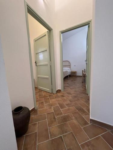Postel nebo postele na pokoji v ubytování Podere Cala Viola