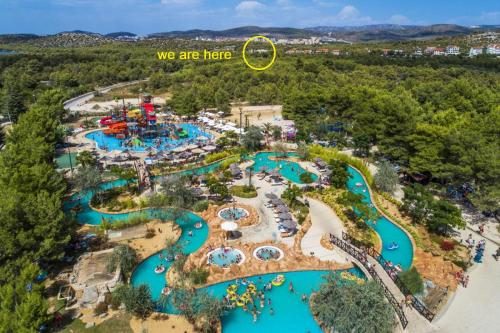 an aerial view of a water park with the words we are here at My Adriatic Suite with private garden in Šibenik