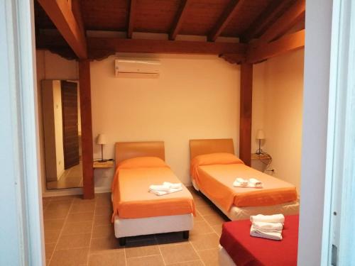 En eller flere senge i et værelse på IL CASALE B&B