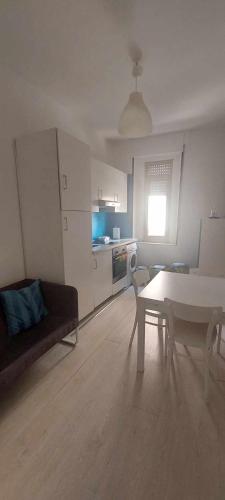 a living room with a couch and a table at Barnet House Lamezia in Lamezia Terme