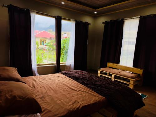 Säng eller sängar i ett rum på Orgventure Resorts Skardu