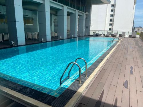 a large swimming pool on top of a building at Platinum 1 in Colombo