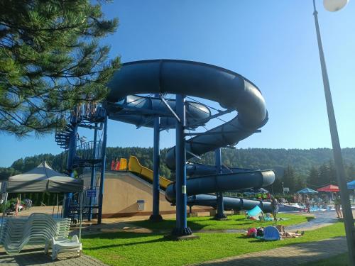 a water slide at a park with a playground at Jasionka in Ustrzyki Dolne