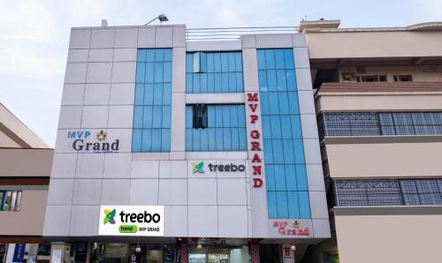 een gebouw met borden aan de zijkant bij Treebo Trend MVP Grand in Visakhapatnam