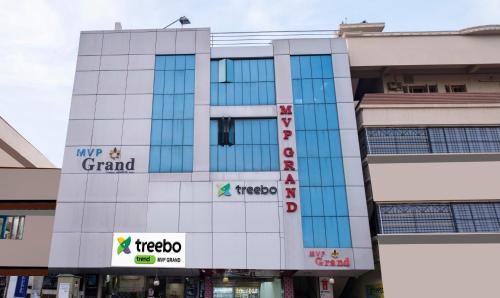 a building with signs on the side of it at Treebo Trend MVP Grand in Visakhapatnam