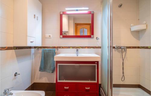 a bathroom with a sink and a tv in it at Gorgeous Apartment In Mlaga With House Sea View in Málaga