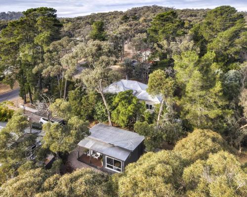 an overhead view of a house in the forest at Aurora Cottage in Hepburn Springs