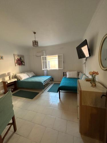 Postel nebo postele na pokoji v ubytování Elenis Studio Corfu Town