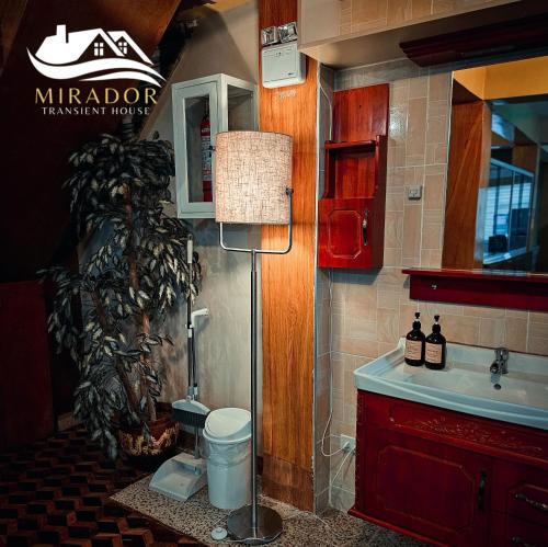 a bathroom with a sink and a toilet in a room at Mirador Old-Time House walking distance to Lourdes Grotto in Baguio