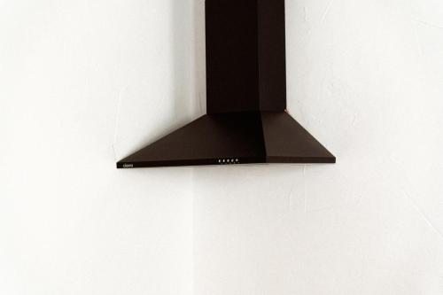 a black light hanging on a wall at Estudio I ideal para parejas en la playa Alguer in L'Ametlla de Mar