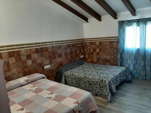 Llit o llits en una habitació de EL ARA DE LOS ORISHAS