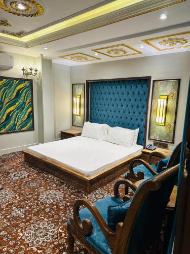 En eller flere senger på et rom på Hotel Delight Skardu