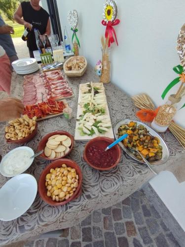 a table with many different types of food on it at Agriturismo Casale Lisalola in Sutri